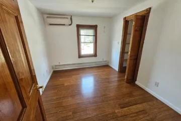 Bedroom with hardwood floors at 175 Park Ave, Passaic NJ