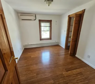 Bedroom with hardwood floors at 175 Park Ave, Passaic NJ