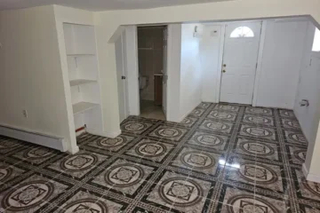 Entryway with decorative tile floor at 175 Park Ave, Passaic NJ