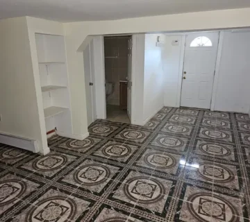 Entryway with decorative tile floor at 175 Park Ave, Passaic NJ