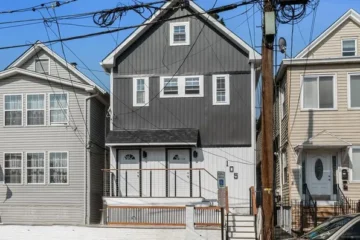 Front exterior of the new-construction two-family home at 105 10th St, Passaic NJ