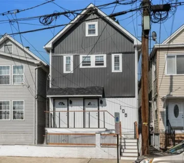 Front exterior of the new-construction two-family home at 105 10th St, Passaic NJ