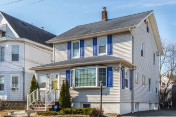Front exterior of the renovated Colonial-style rental home at 164 Day St, Clifton NJ