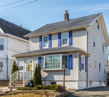 Front exterior of the renovated Colonial-style rental home at 164 Day St, Clifton NJ