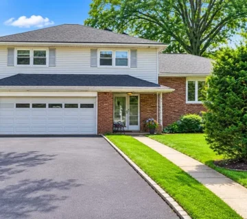 Front exterior of the renovated split-level rental home at 65 Daniels Dr, Clifton NJ