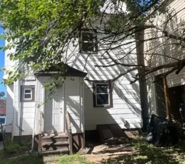 Front exterior of the two-family home at 68 Hoover Ave, Passaic NJ