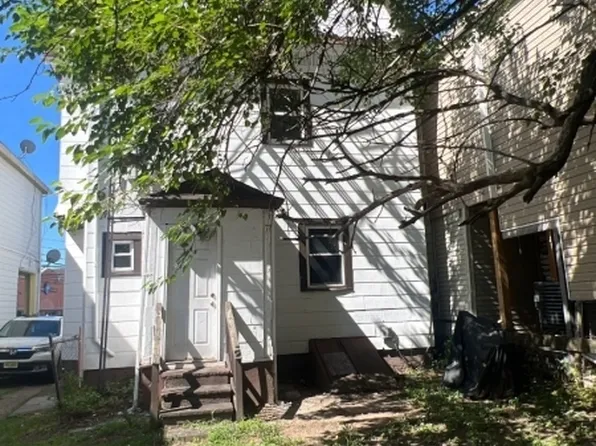 Front exterior of the two-family home at 68 Hoover Ave, Passaic NJ