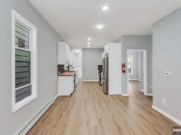 Kitchen with custom butcher-block countertops at 105 10th St, Passaic NJ