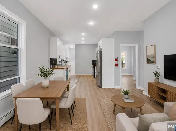 Open living and dining room at 105 10th St, Passaic NJ