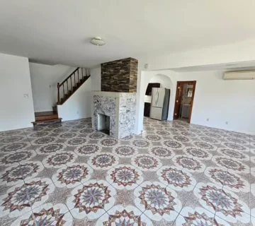 Living room with decorative tile floor and fireplace at 175 Park Ave, Passaic NJ