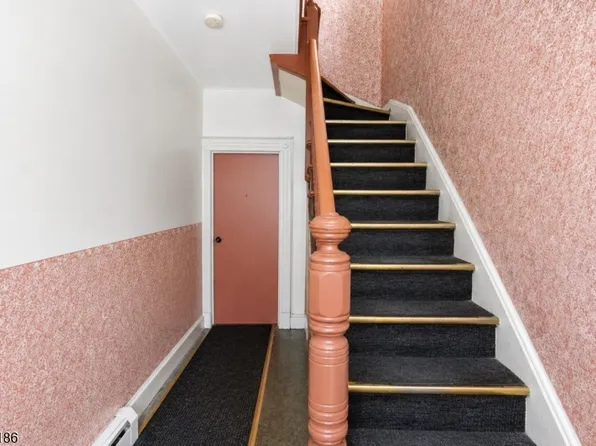 Interior staircase and entryway at 33 Vreeland Ave, Passaic NJ